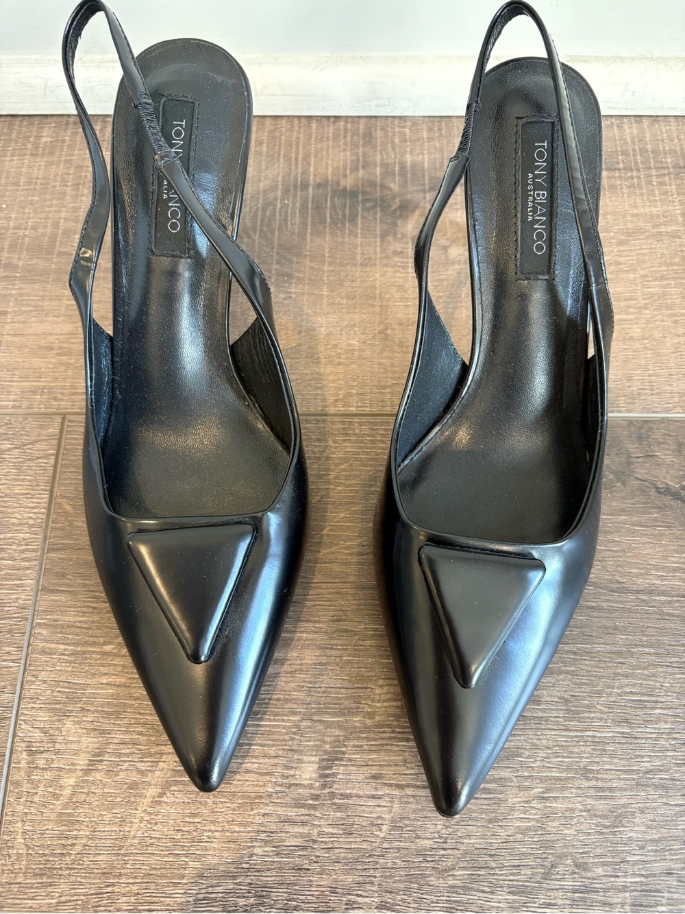 Tony Bianco Black Pointed Slingback Pumps with Triangular Toe Detail.